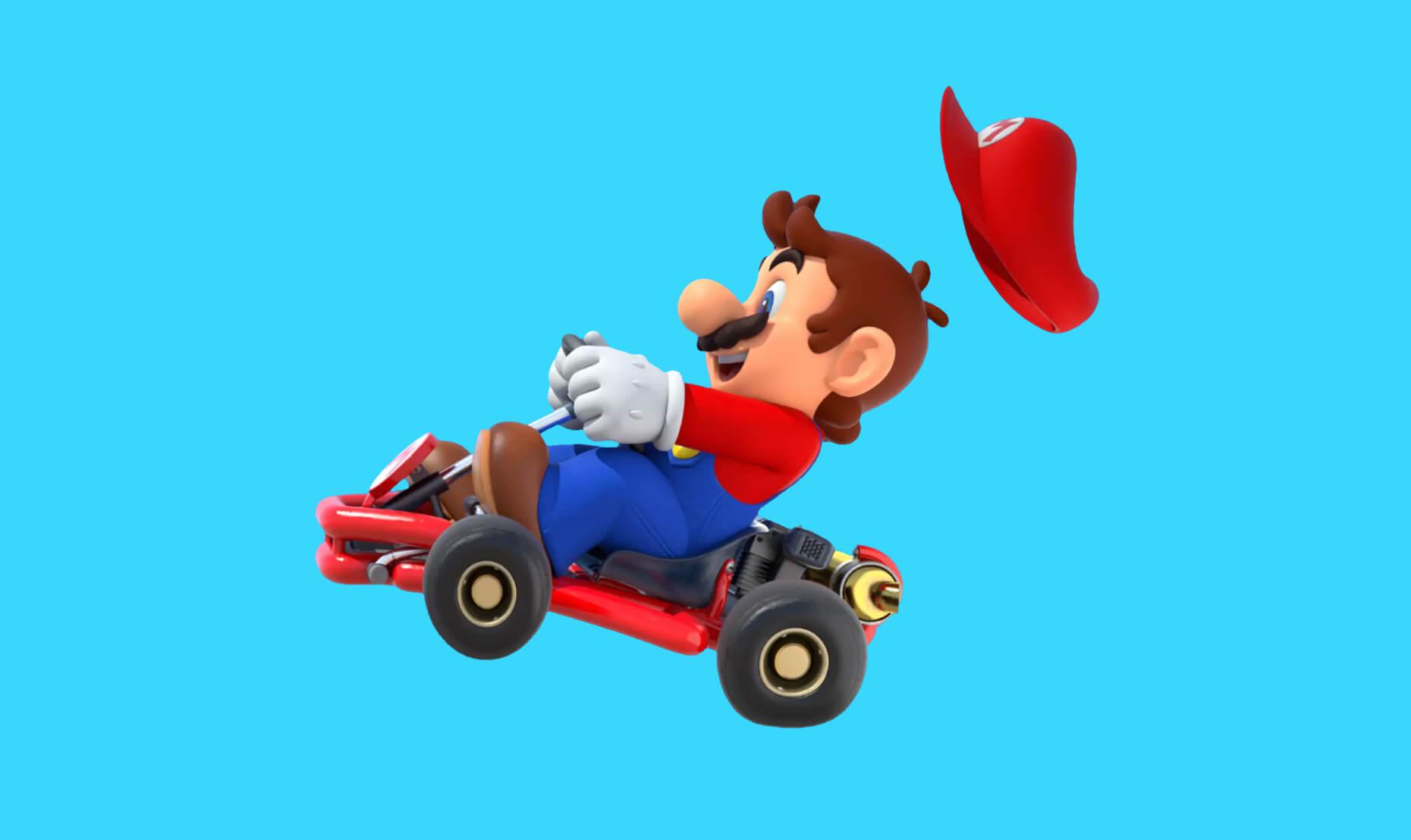 Het karakter Mario op zijn go-kart wiens kart van de grond af komt.